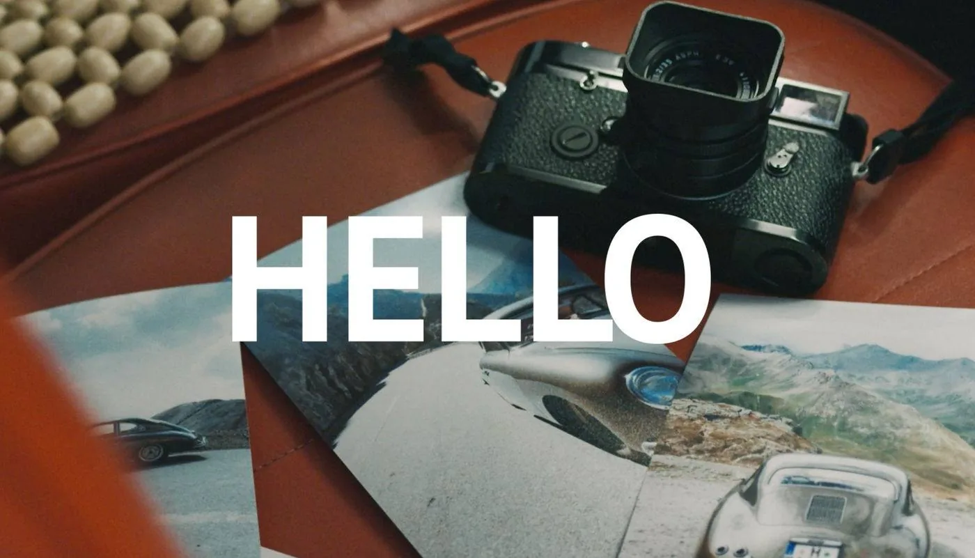 Opening frame of Alex Bowen's showreel: the word Hello over a Leica camera and car photos